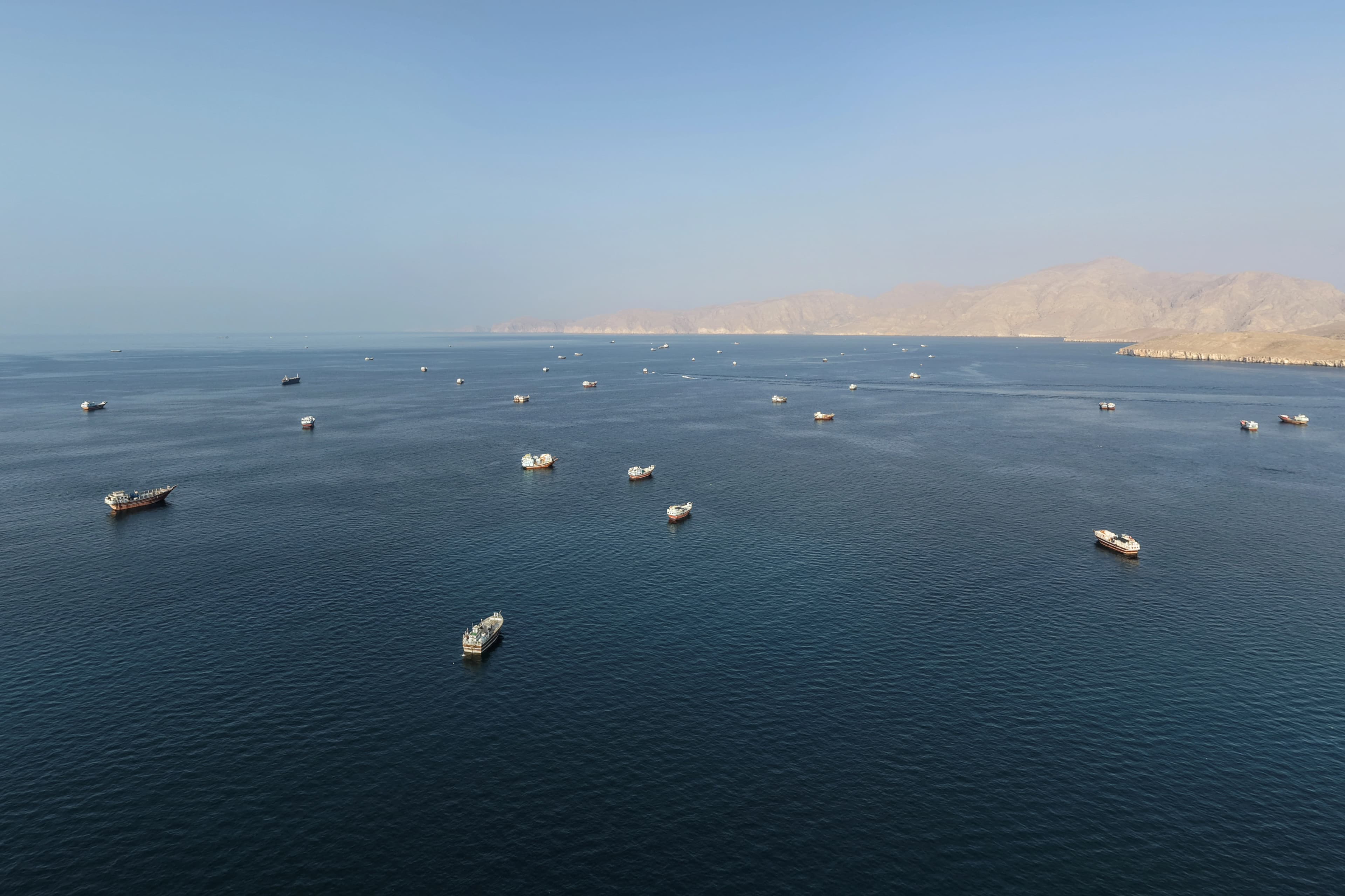 An aerial view shows ships anchored off the coast of Khasab in Oman’s Musandam Governorate, near the Strait of Hormuz, on October 2, 2026. File photo: AFP